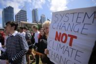 Protesters with placards participate in The Global Strike 4 Climate rally in Sydney