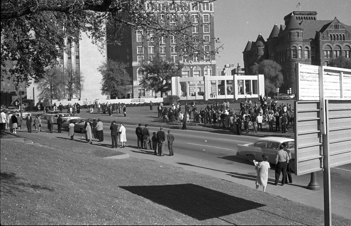Nov. 22, 1963: People waiting on grassy knoll in Dealey Plaza on morning of President John F. Kennedy assassination.