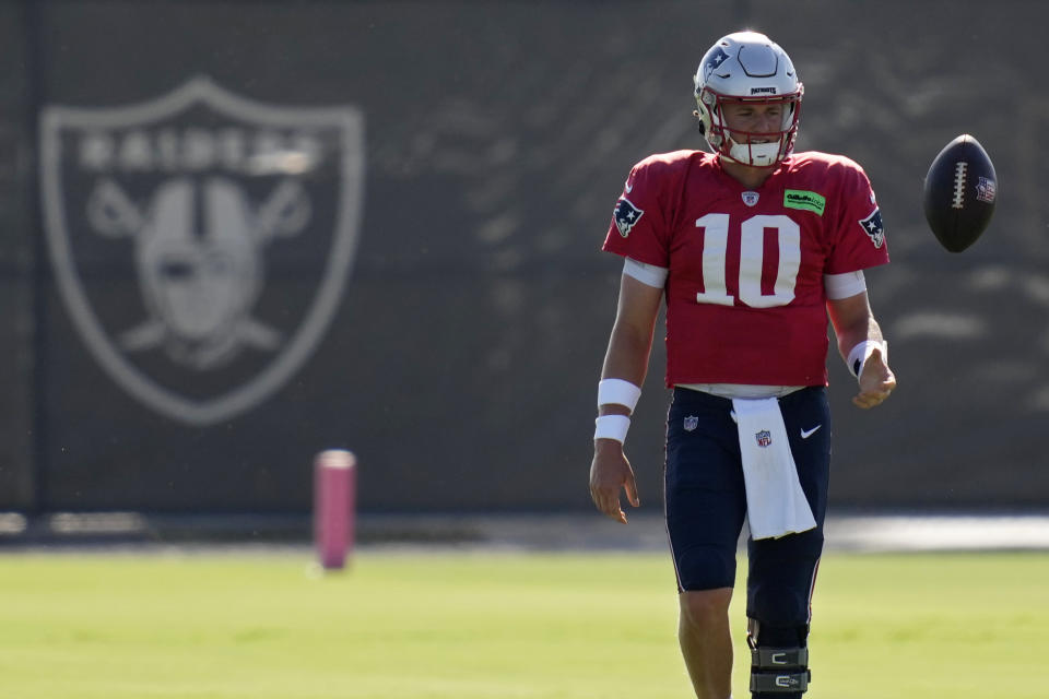 New England Patriots quarterback Mac Jones (10) practices during NFL football training camp Tuesday, Aug. 23, 2022, in Henderson, Nev. (AP Photo/John Locher)