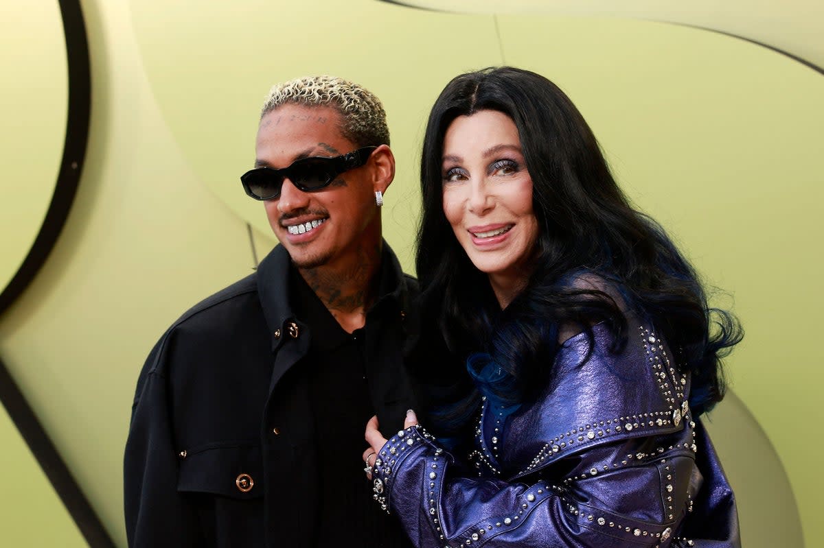 Cher, 76, and boyfriend Alexandra Edwards, 37, made their red carpet debut  (AFP via Getty Images)