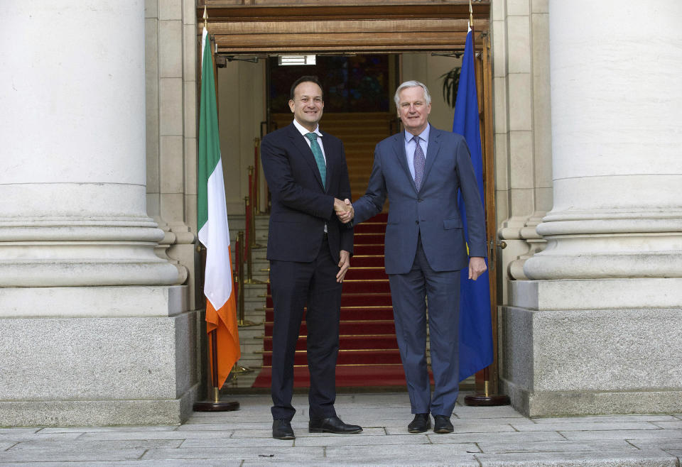 Taoiseach Leo Varadkar meets with Michel Barnier, the EU's Brexit negotiator, ahead of a meeting at Government Buildings in Dublin, Monday, Jan. 27, 2020. Ireland’s prime minister has warned Britain that Brexit is far from finished -- and the European Union will have the upper hand in upcoming negotiations on future relations between the two sides. (Damien Eagers/PA via AP)