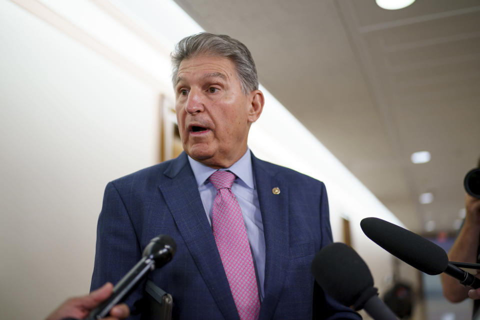 In this Oct. 5, 2021 photo, Sen. Joe Manchin, D-W.Va., talks to reporters as he arrives to chair the Senate Energy and Natural Resources Committee, at the Capitol in Washington. Divided Democrats struggling to enact President Joe Biden’s domestic agenda are confronting one of Congress’ cruelest conundrums — your goals may be popular, but that doesn't ensure they'll become law or that voters will reward you. (AP Photo/J. Scott Applewhite)