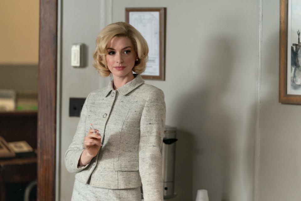 "Rebecca enjoys the feeling of attracting people," Anne Hathaway says of her "Eileen" character.