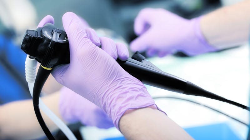 A doctor holding an instrument used for endoscopy. - Image: sfam_photo (Shutterstock)