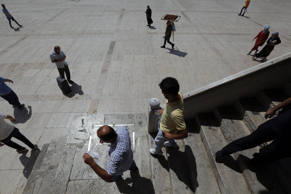 In this photo taken on Tuesday, Aug. 20, 2019, people leave the Fatih mosque following prayers in Istanbul. Syrians say Turkey has been detaining and forcing some Syrian refugees to return back to their country the past month. The expulsions reflect increasing anti-refugee sentiment in Turkey, which opened its doors to millions of Syrians fleeing their country's civil war. (AP Photo/Lefteris Pitarakis)
