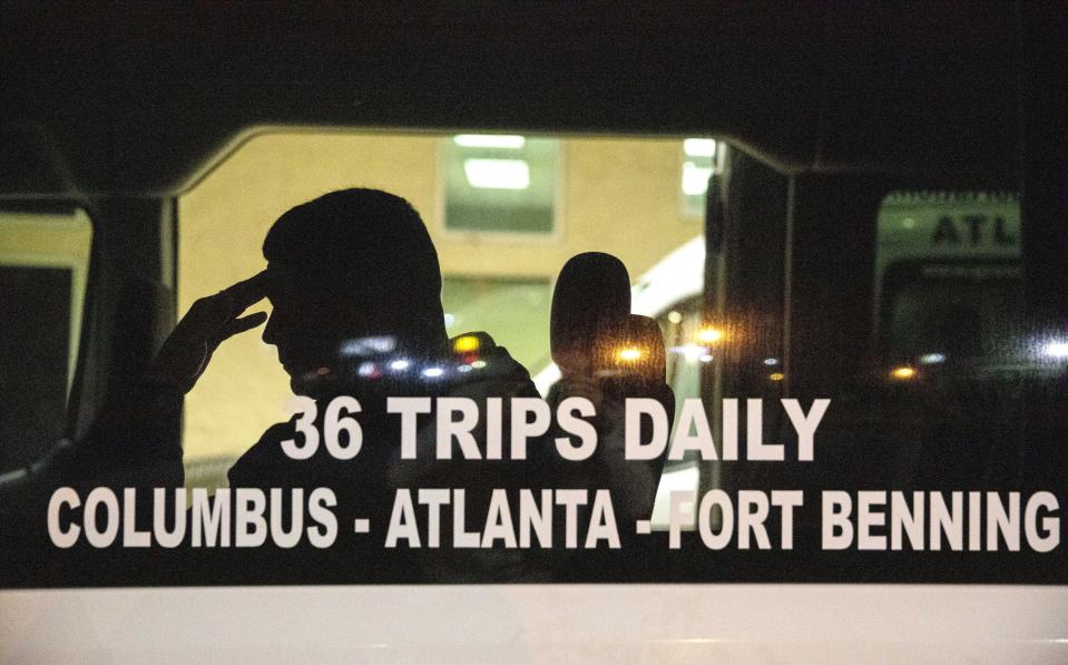 Yasnier Palacio Nieves boards a bus for the airport to be reunited with his fiancee in Miami since the couple entered the U.S. together to seek asylum from Cuba, after his release on parole from the Stewart Detention Center, Wednesday, Nov. 6, 2019, in Columbus, Ga. (AP Photo/David Goldman)