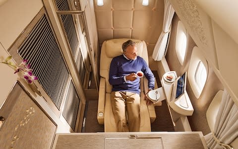 Emirates' new fully enclosed first class cabins on board its Boeing 777 aircraft will feature full-flat beds that offer a "zero gravity" position - Credit: Emirates