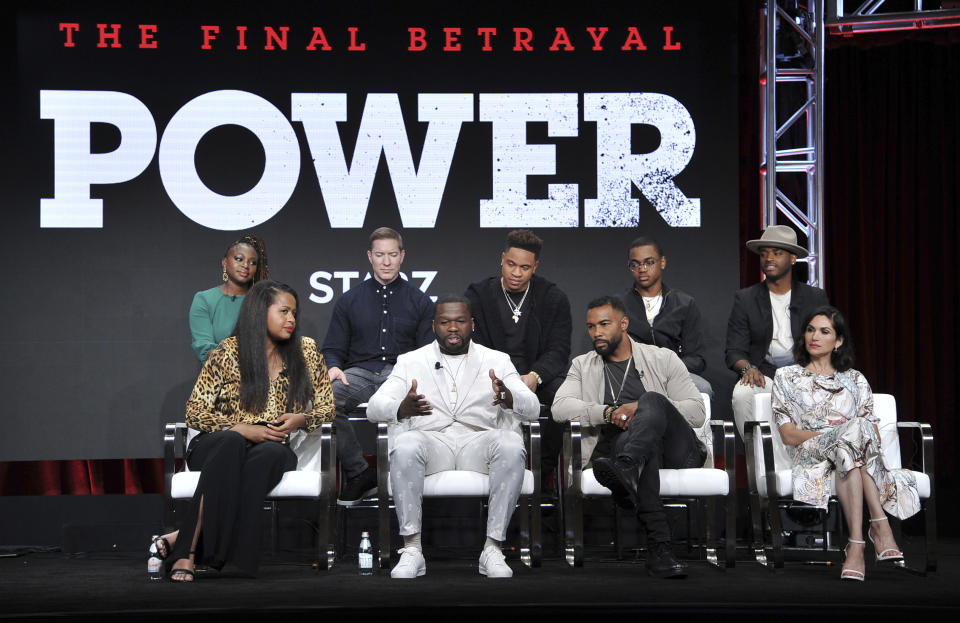Naturi Naughton, from back row left, Joseph Sikora, Rotimi, Michael Rainey, Jr., Larenz Tate, and from front row left, creator/executive producer Courtney A. Kemp, Curtis "50 Cent" Jackson, Omari Hardwick and Lela Loren participate in the Starz "Power" panel at the Television Critics Association Summer Press Tour on Friday, July 26, 2019, in Beverly Hills, Calif. (Photo by Richard Shotwell/Invision/AP)