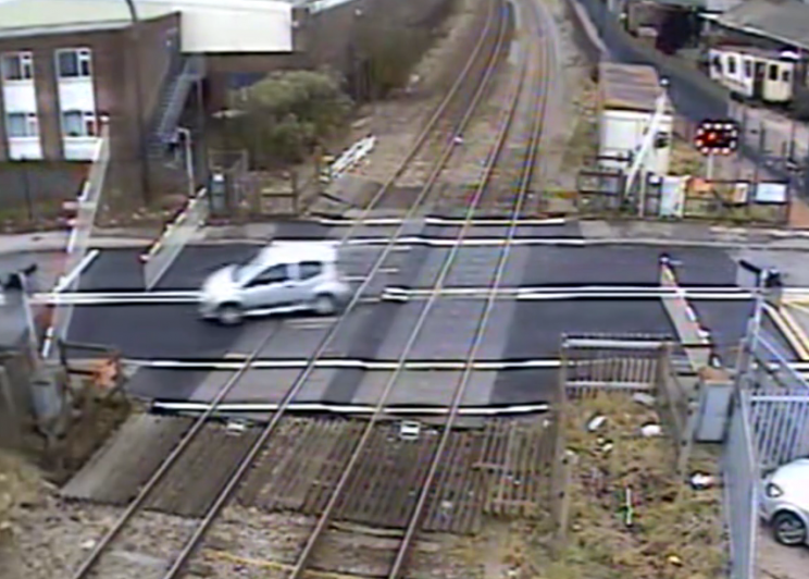 The car speeds over the crossing (Picture: Network Rail)