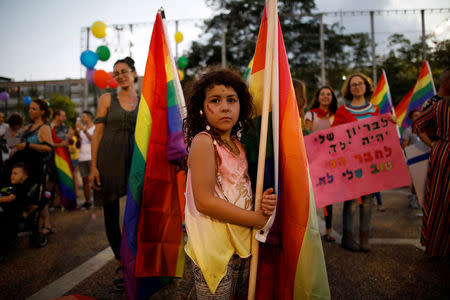Protesters take part in a LGBT community members protest against discriminatory surrogate bill in Rabin Square in Tel Aviv, Israel, July 22, 2018. REUTERS/Corinna Kern