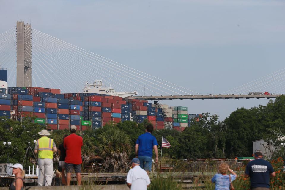 Spectators look on as the CMA CGM Marco Polo heads under the Talmadge Bridge in route to the Port of Savannah.