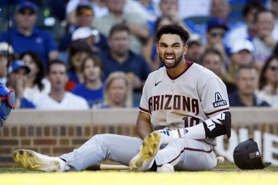 Arizona Diamondbacks' Jordan Lawlar (10) reacts after being hit by a pitch during the tenth inning of a baseball game against the Chicago Cubs Saturday, Sept. 9, 2023, in Chicago. Arizona won 3-2 in ten innings. (AP Photo/Paul Beaty)