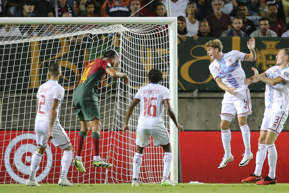 Portugal's Goncalo Inacio, 2nd left, scores his side's fourth goal during the Euro 2024 group J qualifying soccer match between Portugal and Luxembourg at the Algarve stadium outside Faro, Portugal, Monday, Sept. 11, 2023. (AP Photo/Joao Matos)