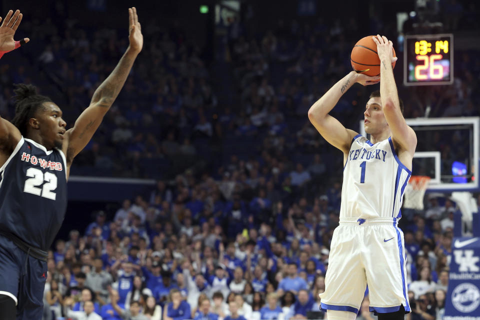 Kentucky's CJ Fredrick (1) shoots over Howard's Shy Odom (22) during the first half of an NCAA college basketball game in Lexington, Ky., Monday, Nov. 7, 2022. (AP Photo/James Crisp)