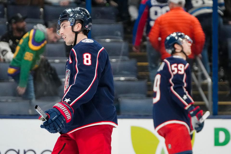 Dec 5, 2023; Columbus, Ohio, USA; Columbus Blue Jackets defenseman Zach Werenski (8) and right wing Yegor Chinakhov (59) react to a goal by Los Angeles Kings defenseman Drew Doughty (8) in overtime of the NHL game at Nationwide Arena. The Blue Jackets lost 4-3 in overtime.