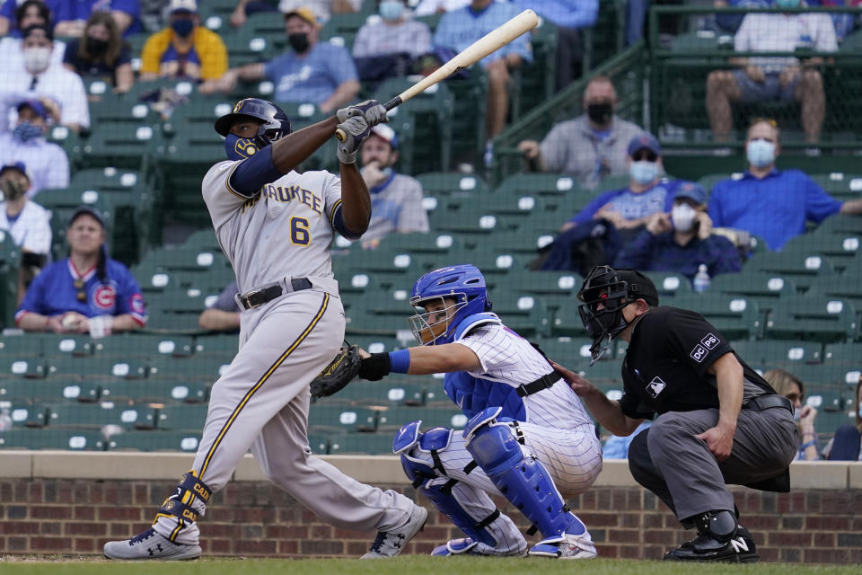 Milwaukee Brewers' Lorenzo Cain hits a three-run home run against the Chicago Cubs during the 10th inning of a baseball game in Chicago, Wednesday, April 7, 2021. (AP Photo/Nam Y. Huh)