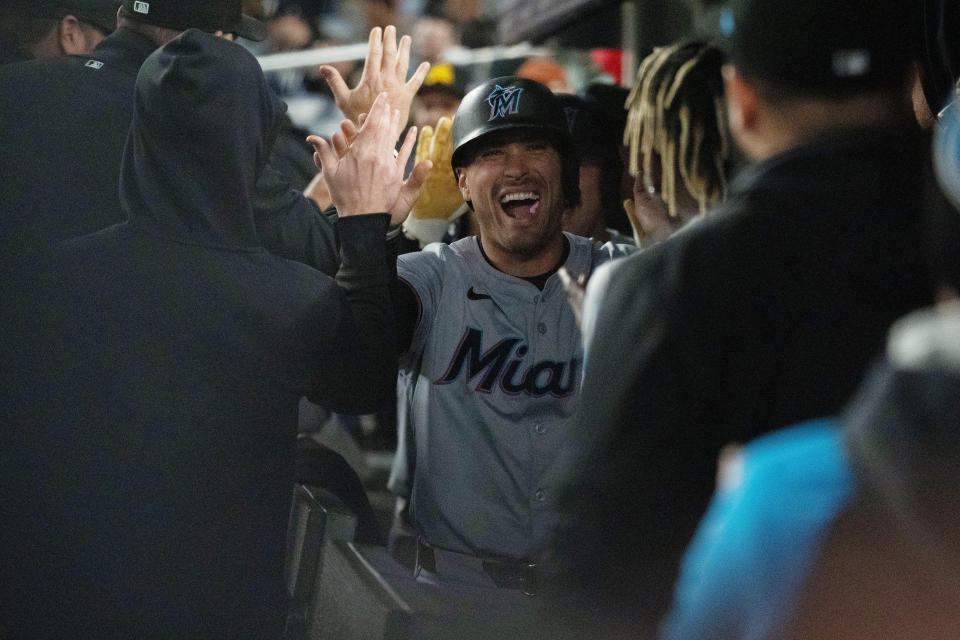 Miami Marlins' Nick Fortes is congratulated in the dugout after scoring against the New York Yankees during the third inning of a baseball game Wednesday, April 10, 2024, in New York. (AP Photo/Peter K. Afriyie)