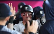 FILE PHOTO: Apr 22, 2019; Anaheim, CA, USA; New York Yankees left fielder Clint Frazier (77) celebrates after scoring in the twelfth inning against the Los Angeles Angels at Angel Stadium of Anaheim. Mandatory Credit: Richard Mackson-USA TODAY Sports