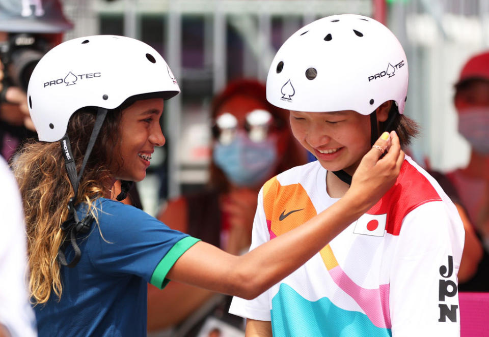 Rayssa Leal puts her hand up to the face of Momiji Nishiya during the Women's Street Final at the Tokyo 2020 Olympic Games on July 26.<span class="copyright">Patrick Smith—Getty Images</span>