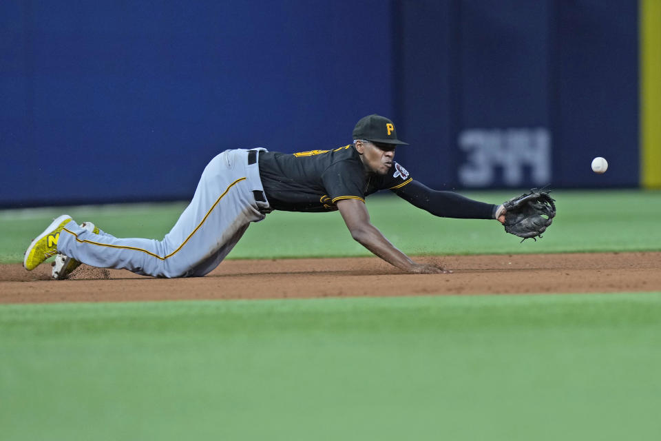 Pittsburgh Pirates third baseman Ke'Bryan Hayes dives for a ball hit by Miami Marlins' Joey Wendle during the eighth inning of a baseball game, Thursday, June 22, 2023, in Miami. (AP Photo/Wilfredo Lee)