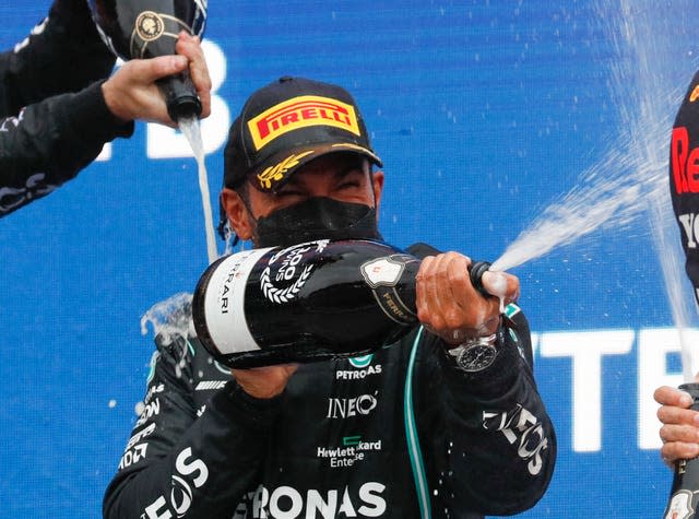 Lewis Hamilton celebrates on the podium