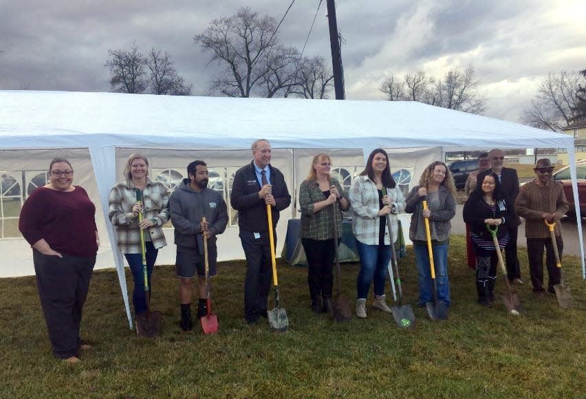 Officials wait to break ground on a new site for Richland Outreach Center during a ceremony Wednesday afternoon.