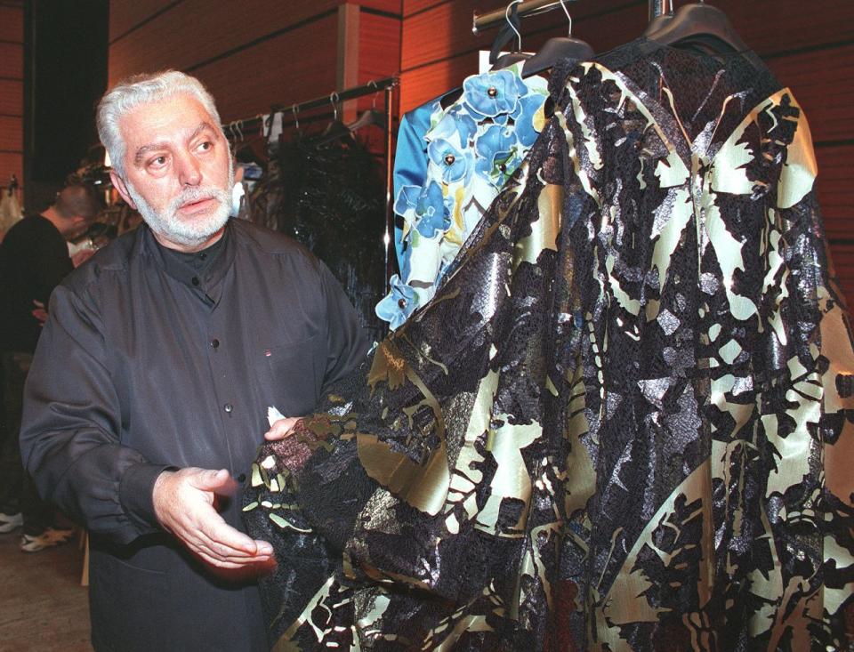 Fashion designer Paco Rabanne checking a dress before the presentation of his Spring/Summer 1999 haute-couture collection, January 20, 1999 in Paris.