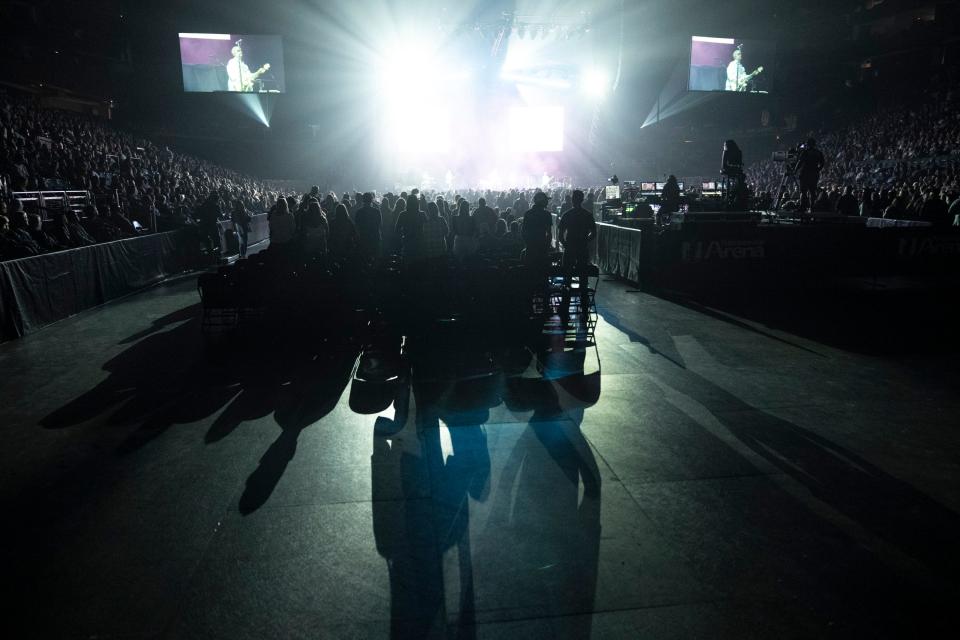 Shadows from stage lights are seen projected onto the floor as Tyler Hubbard opens for Keith Urban during a concert Friday night at Nationwide Arena.