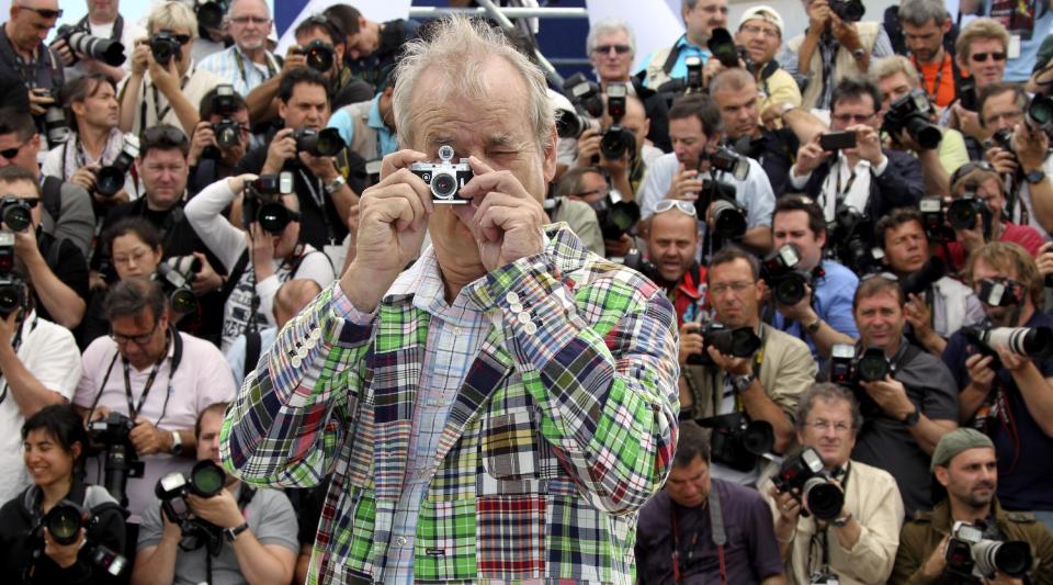 Actor Bill Murray plays with a camera during a photo call for Moonrise Kingdom at the 65th international film festival, in Cannes, southern France, Wednesday, May 16, 2012. (AP Photo/Joel Ryan)