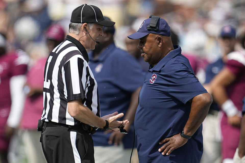 South Carolina State head coach Oliver Pough speaks with an official during the first half of an NCAA college football game against Georgia Tech, Saturday, Sept. 9, 2023, in Atlanta. (AP Photo/Mike Stewart)