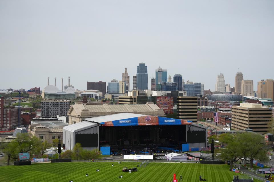 The 2023 NFL Draft stage is set up outside Kansas City's Union Station with the downtown skyline in the background. The draft kicks off with the first round on Thursday night and continues through Saturday.