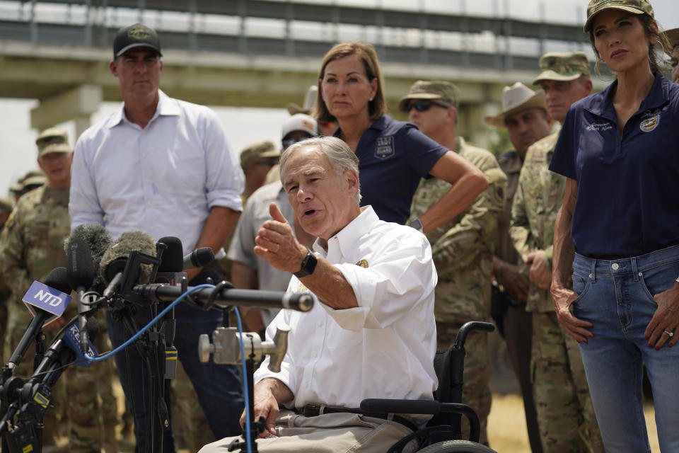 Gov. Abbott is seated near Oklahoma Gov. Kevin Stitt, Iowa Gov. Kim Reynolds, and South Dakota Gov. Kristi Noem, who are standing.