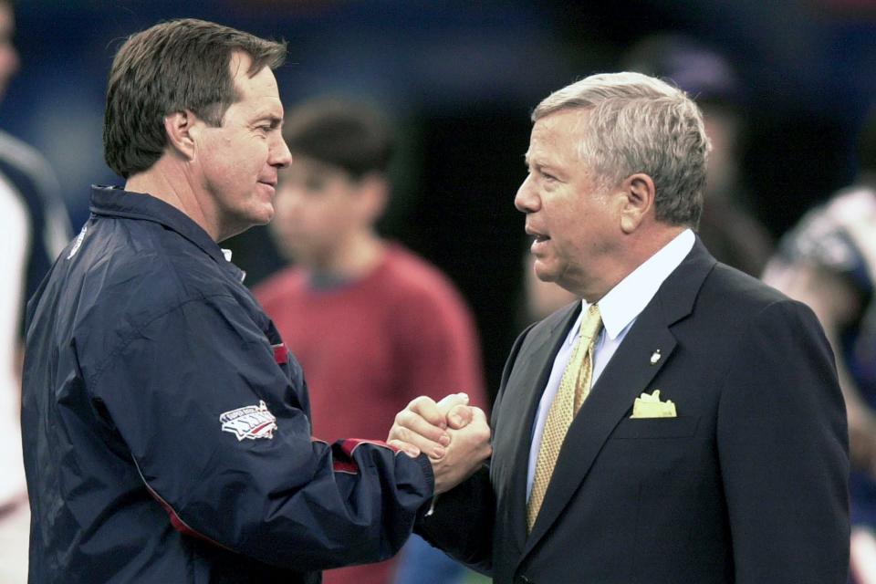 FILE - New England Patriots coach Bill Belichick, left, shakes hands with team owner Robert Kraft during a walk through of the Louisiana Superdome in New Orleans Saturday, Feb. 2, 2002. Six-time NFL champion Bill Belichick has agreed to part ways as the coach of the New England Patriots on Thursday, Jan. 11, 2024, bringing an end to his 24-year tenure as the architect of the most decorated dynasty of the league’s Super Bowl era, a person with knowledge of the situation told The Associated Press on the condition of anonymity because it has not yet been announced.(AP Photo/Steven Senne)