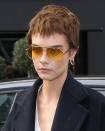 <p>Last month? A bleached blonde buzzcut. Last week? A platinum shoulder length wig. Today? Yup, Cara's switched her hair up again and dyed her pixie crop a chestnut brown. We're feeling major Mia Farrow vibes...</p>