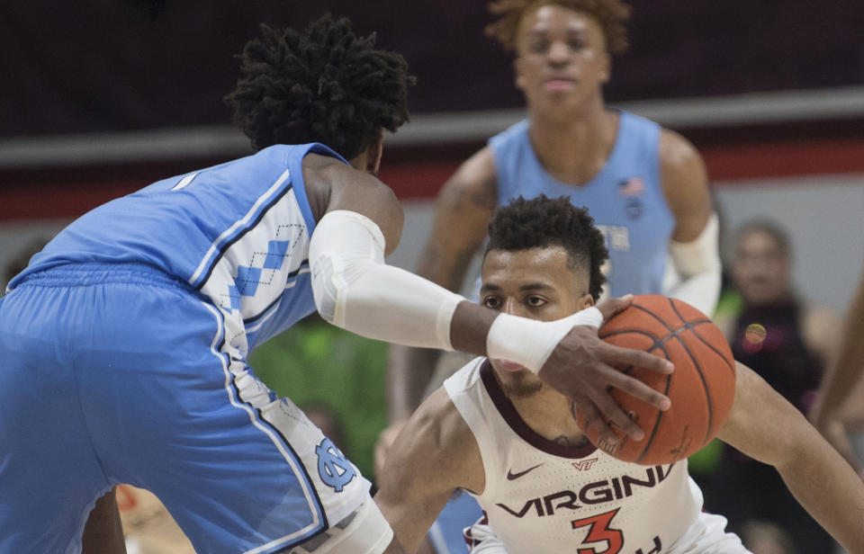 Virginia Tech defender Wabissa Bede guards North Carolina guard Rechon Black (3) during the second half of an NCAA college basketball game in Blacksburg, Va., Wednesday, Jan. 22, 2020.(AP Photo/Lee Luther Jr.)