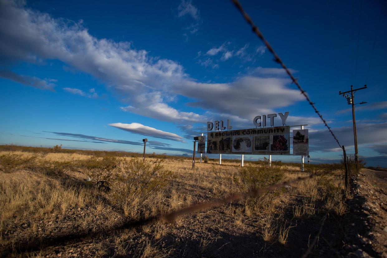 A sign that welcomes visitors to Dell City calls the town by the nickname "Valley of Hidden Waters." Dell City's agricultural abundance relies on water from the Bone Spring-Victorio aquifer, a resource El Paso Water aims to develop for importation to El Paso.  (Corrie Boudreaux/El Paso Matters)