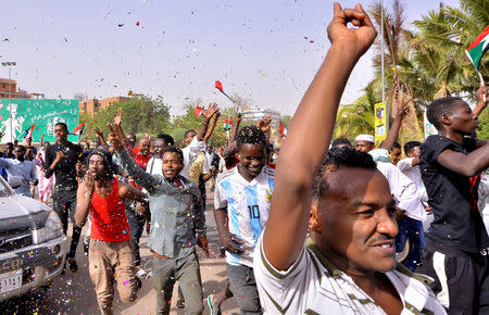 FILE PHOTO - Demonstrators chant slogans along the streets after Sudan's Defense Minister Awad Mohamed Ahmed Ibn Auf said that President Omar al-Bashir had been detained "in a safe place" and that a military council would run the country for a two-year transitional period in Khartoum, Sudan April 11, 2019. REUTERS/Stringer