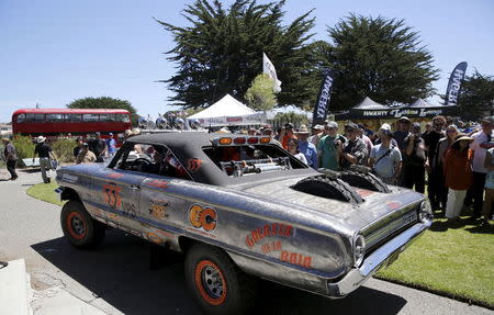 A 1964 Ford Fairline drives off after winning the "Worst of Show" award at the Concours d'Lemon, a part of the Pebble Beach Concours d'Elegance in Seaside, California, August 15, 2015. REUTERS/Robert Galbraith