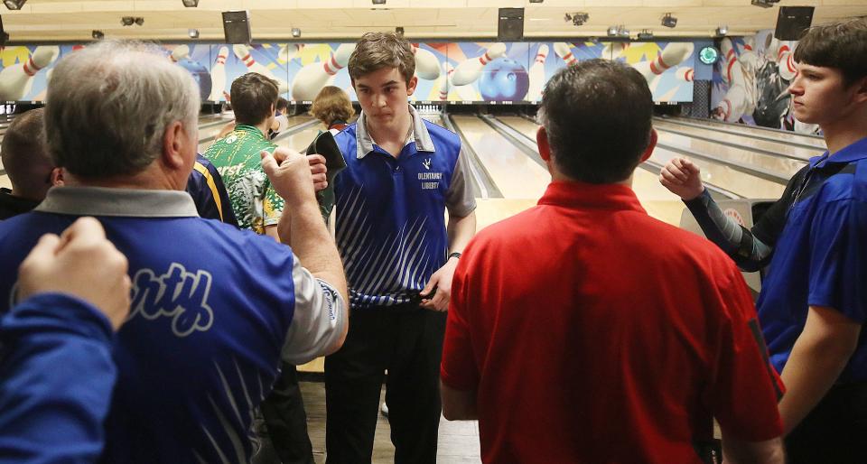 Olentangy Liberty's Carter Street is congratulated after rolling a 289 in the first game of the Division I state tournament March 11 at Wayne Webb's Columbus Bowl. Street won the state title with a 732 three-game series.
