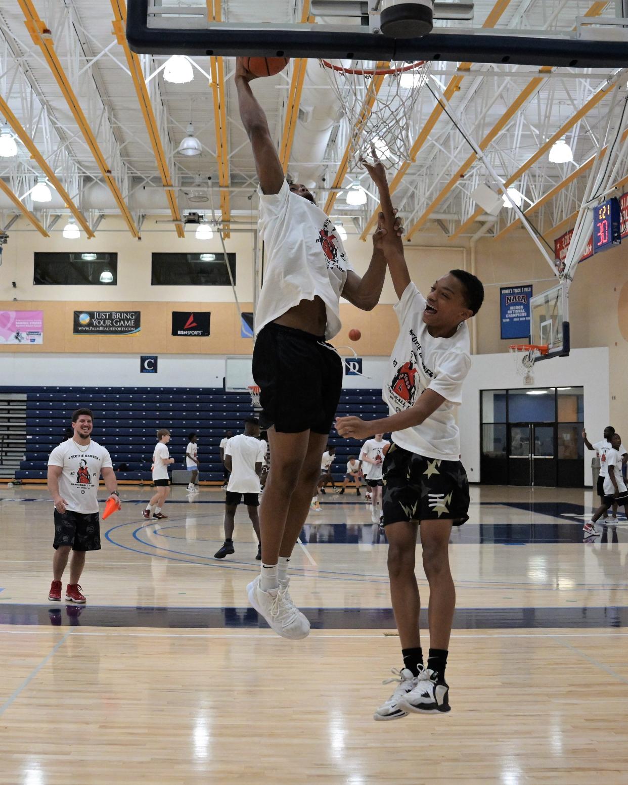 Scottie Barnes dunks against one of the registered youth basketball players in his partnered instructional camp. After a number of drills, Barnes stepped onto the court and tested kids' skills, and certainly didn't shy from impressing at the rim - much to the kids' enjoyment.