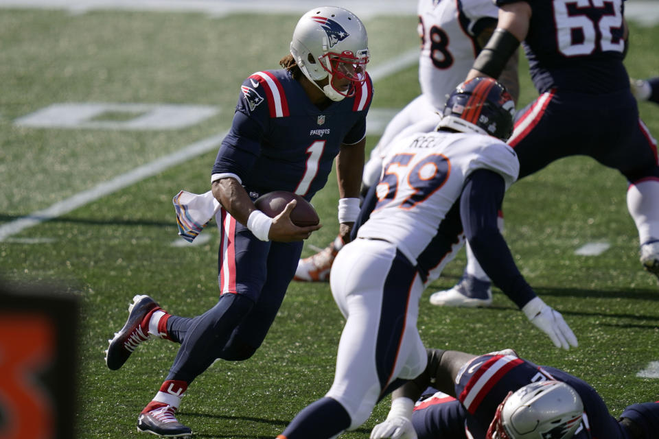 New England Patriots quarterback Cam Newton (1) runs for yardage against the Denver Broncos in the first half of an NFL football game, Sunday, Oct. 18, 2020, in Foxborough, Mass. (AP Photo/Charles Krupa)