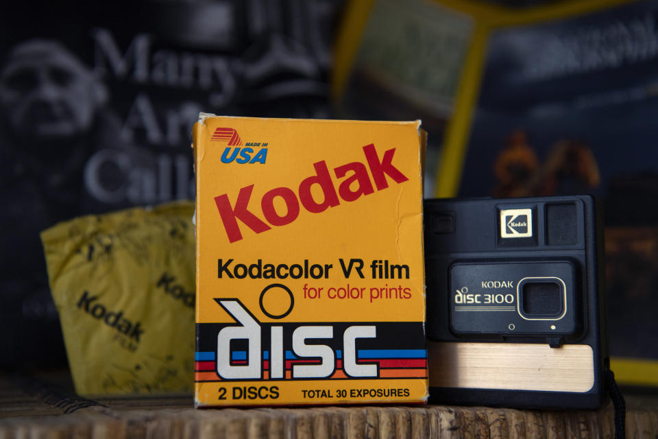 Kodak color film next to a Kodak disc 3100 camera