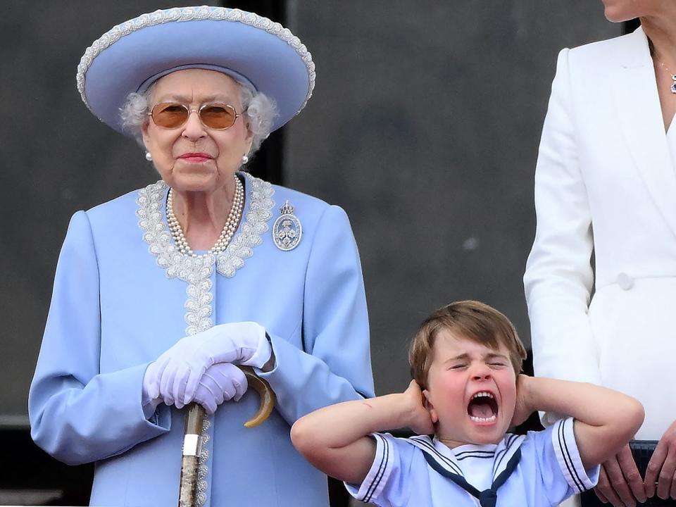 Queen Elizabeth stands next to Prince Louis as he screams at Trooping the Colour 2022.