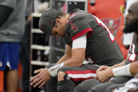 Tampa Bay Buccaneers quarterback Tom Brady looks down as he sits on the bench during the second half of an NFL football game against the Los Angeles Rams Sunday, Sept. 26, 2021, in Inglewood, Calif. (AP Photo/Jae C. Hong)