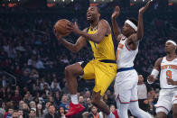 Indiana Pacers forward T.J. Warren (1) goes to the basket past New York Knicks guard Frank Ntilikina (11) in the first half of an NBA basketball game, Friday, Feb. 21, 2020, at Madison Square Garden in New York. (AP Photo/Mary Altaffer)