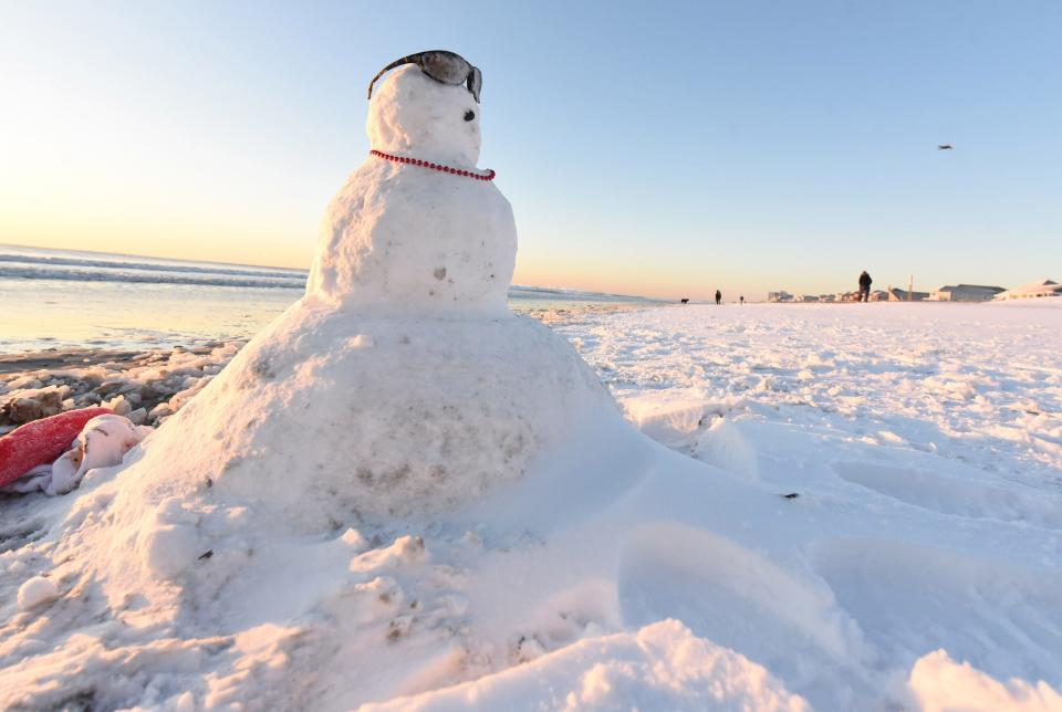 A snowman rest along the shore at Wrightsville Beach early Thursday morning Jan. 4, 2018. [STARNEWS FILE PHOTO]