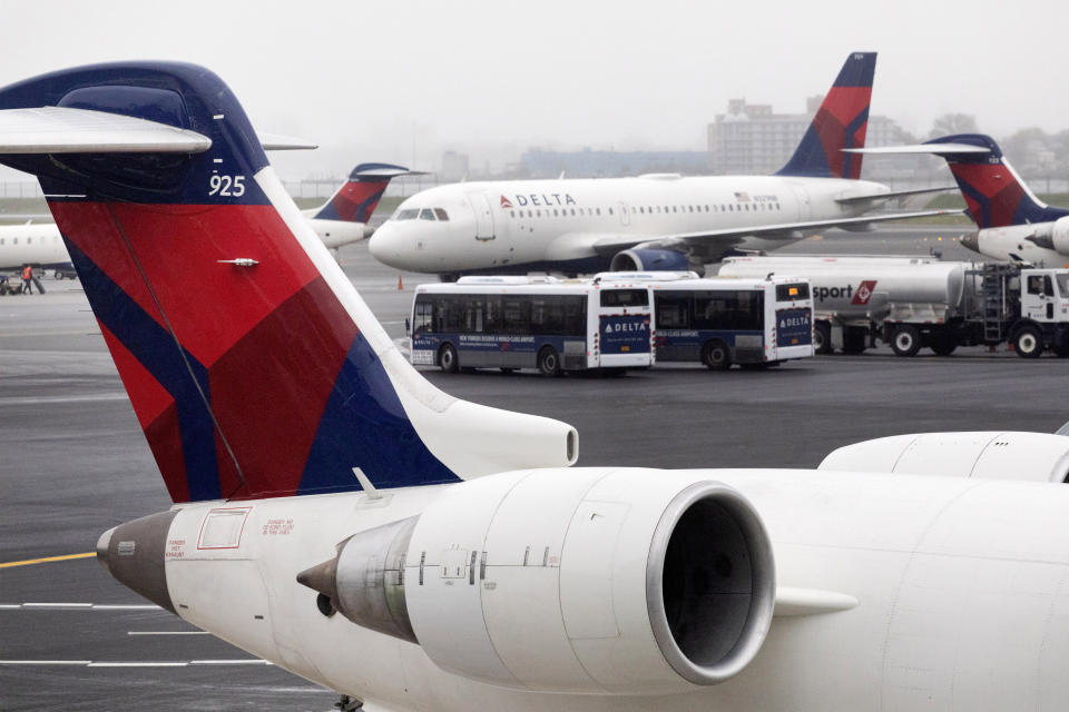 FILE - In this Oct. 29, 2019, file photo Delta Air Lines planes operate at the new $3.9 billion Terminal C at LaGuardia Airport in New York. The Atlanta-based carrier will report financial results Tuesday, Jan. 14, 2020. (AP Photo/Mark Lennihan, File)