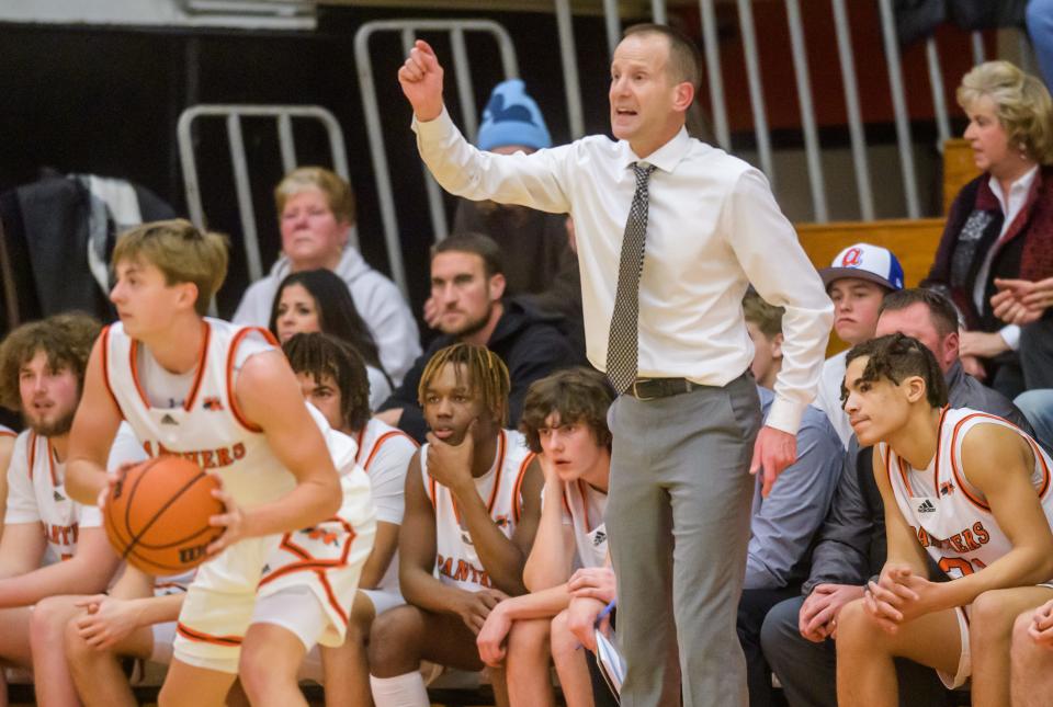 Washington Panthers head coach Eric Schermerhorn directs his team as they battle East Peoria on Friday, Dec. 16, 2022 in Washington. The Raiders fell to the Panthers 52-45.