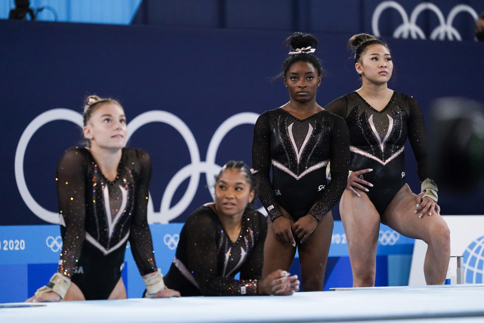 From left, Grace McCallum, Jordan Chiles, Simone Biles, and Sunisa Lee of the United States wait their turn to train on vault for artistic gymnastics at Ariake Gymnastics Centre venue ahead of the 2020 Summer Olympics, Thursday, July 22, 2021, in Tokyo, Japan. (AP Photo/Ashley Landis)