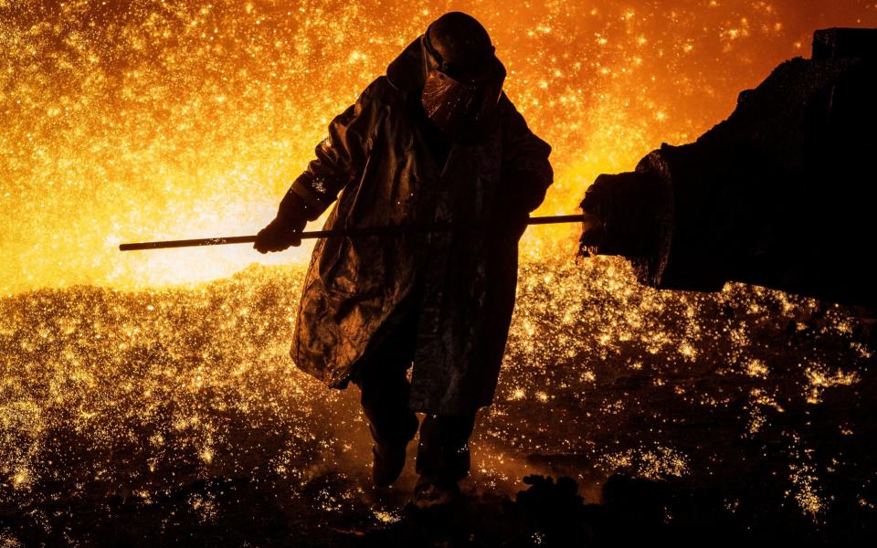 A worker at a blast furnace in the Port Talbot steelworks in Wales